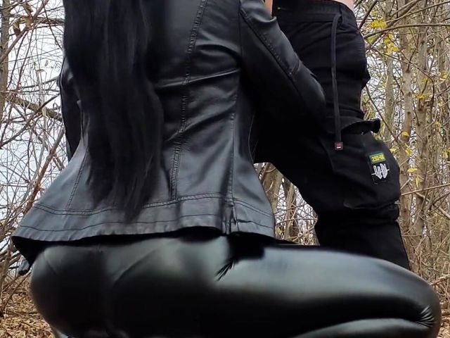 Ponytail Girl in a Leather Outfit Sucks Cock in the Forest and Takes Cum on Her Face - Vertical Vid (Sucker punch prod)