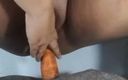 Gordita Culo Rico: My Neighbor Records Herself Playing with a Carrot