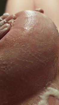 A Naked Woman with Huge Tits in a Massage Parlor Using Whipped Cream.