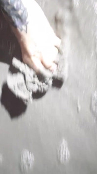 Beach Feet Covered in Wet Sand