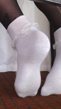 Ruffled Socks Over Black Pantyhose