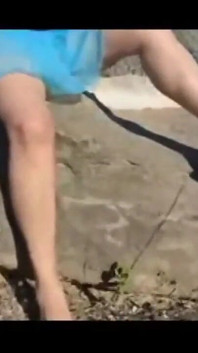Mel walking on the side of the road