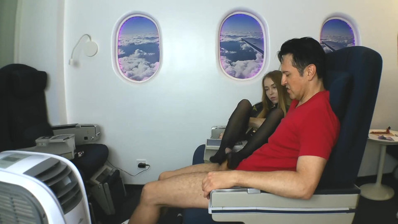 Foot Girls: Stewardess gives nylon footjob in plane!