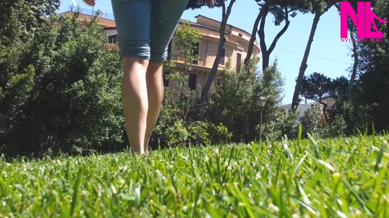 Nyllady: Nyllady Walking Barefoot on Th Grass in a Park