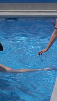 Lesbian Girls Are Having Fun in a Pool with an Inflatable Shark