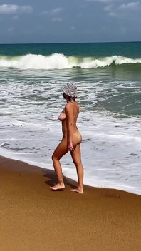 A Busty Blonde Is Walking and Sunbathing Naked