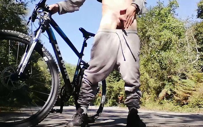 Nino boy: Young man playing with his bike with dildo in his...