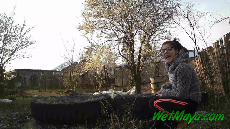 Wet Maya: Peeing on some old tires in the yard