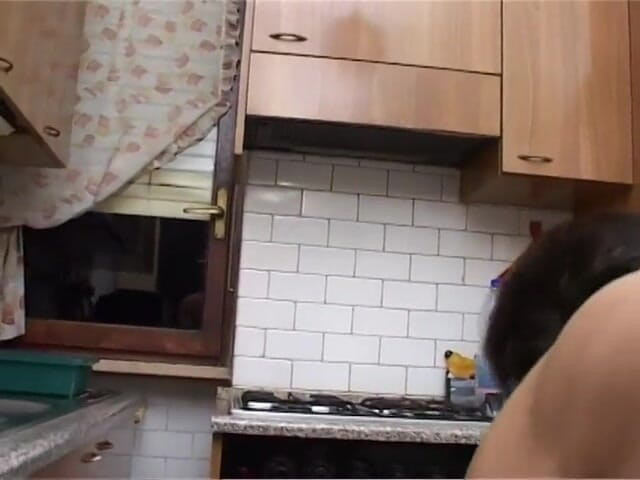 Milf in Love: Lustful brunette gets banged in the kitchen by a young...