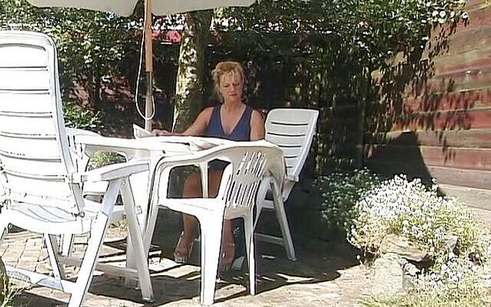 Lucky Cooch: Blonde milf showing off her boobs outdoors