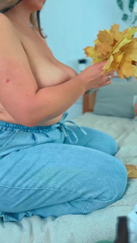 A Big Smile From a Beautiful MILF with Leaves