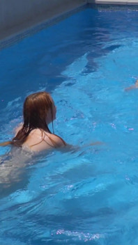 Lesbian Girls Are Having Fun in a Pool with an Inflatable Shark