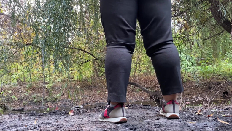 Elena: MILF dressed in pants pissing outdoors