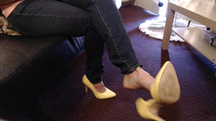 Abby Anna: Double crossed yellow pumps dangling