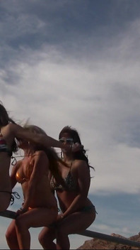 Three Girls in Bikinis on a Mountain Top Get Naked and Play with Each Other