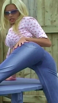 Pissing in her denim jeans