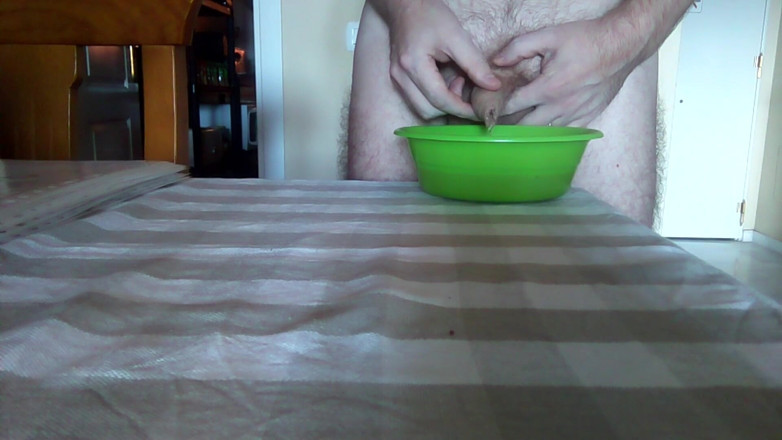Sex hub male: John is peeing into a green bowl on the table