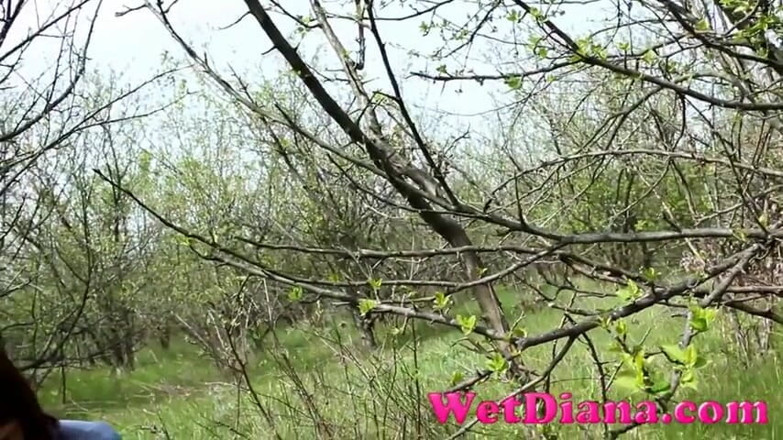 Wet Diana: Pissing in the grass with legs wide opened and wipe...