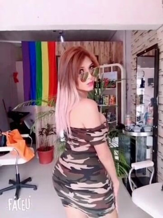 Barbietransxxxx: Tranny in a square showing off her tits in front...