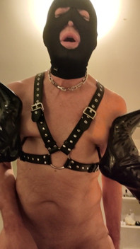 Mistress Digs the Heels of Her Boots Into Her Slave