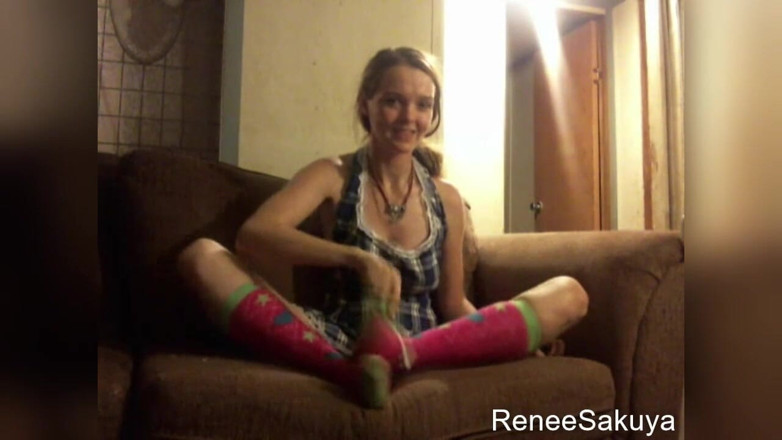 Renee Sakuya: Tickling feet indoors on couch with toothbrush, wearing long knee...