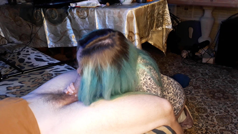 Blowjobs Alice: Asian woman with blue hair touches an uncut dick with...