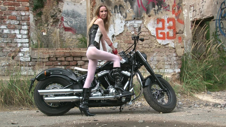 Public Entertainment: Skinny blonde on a bike