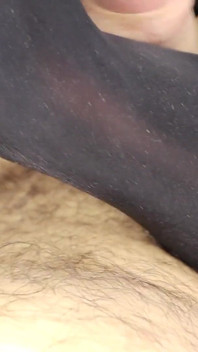 Jerks off his feet. Latex. Cum on legs