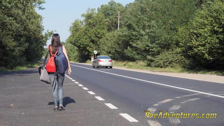 Pee Adventures: Skinny brunette hitchhiking with her bladder full