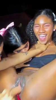 Beautiful Lesbians Play with a Huge Dildo in Their Brunette Friend's Pussy
