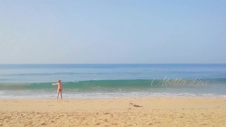 Abella Love: Slim MILF taking sun bath and peeing twice on beach