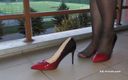 Aqua Pola: Dipping classic red high heels on balcony