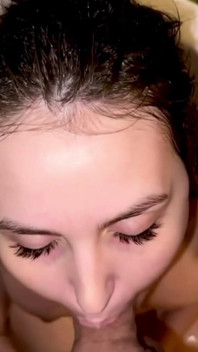 Stepmom Tries to Take It All in Her Mouth While Sitting in the Shower