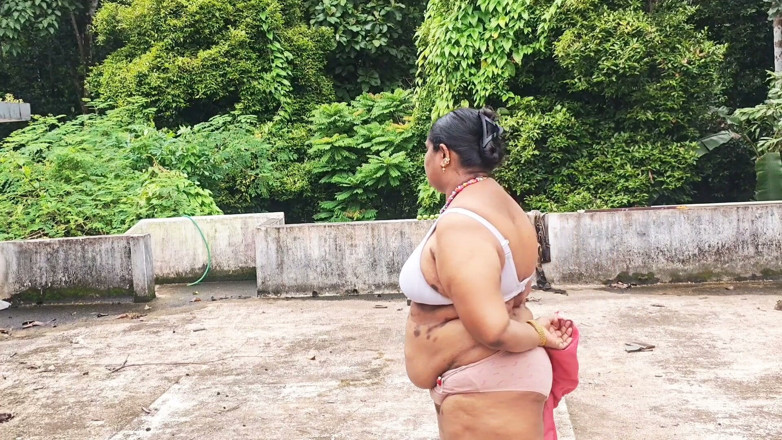 Anne Ipe: A Full-figured Woman in a White Skirt and Pink Top...