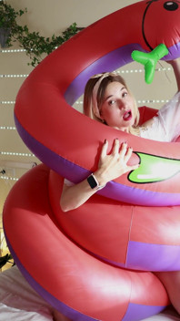 A Sexy Girl Rides an Inflatable Snake in Provocative Lingerie