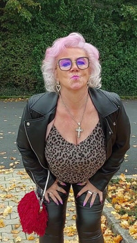 Naughty Granny Tongue Out Flashing Big Tits in Public