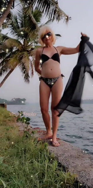 Abella Love: Undressing near Tropical river