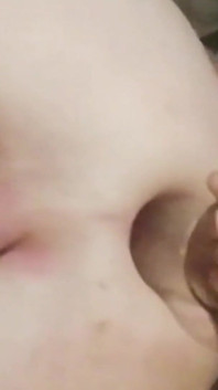 Skinny young man swallows his own urine and opens his ass wide