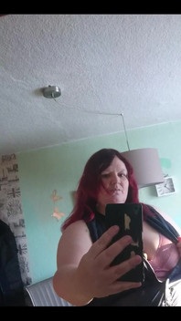 Showing off in a cool lab coat in front of the mirror