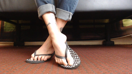 Abby Anna: Dotted flipflop shoe play closeup