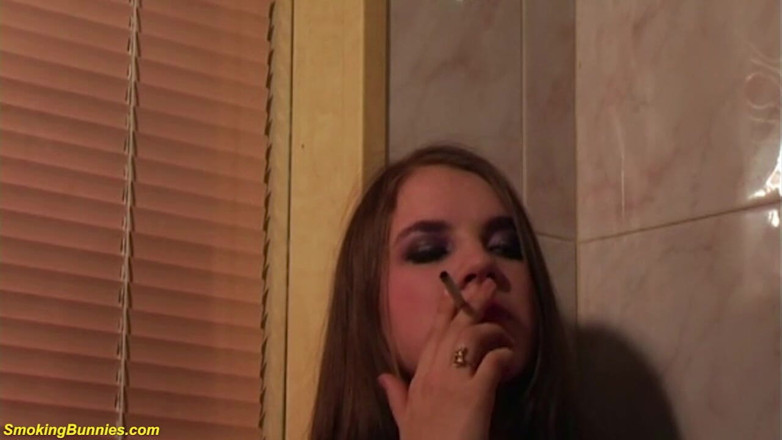 Smoking Bunnies: Busty babe smoking at the bathroom