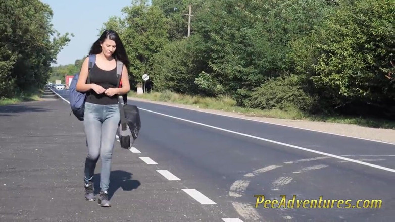 Pee Adventures: Skinny brunette hitchhiking with her bladder full