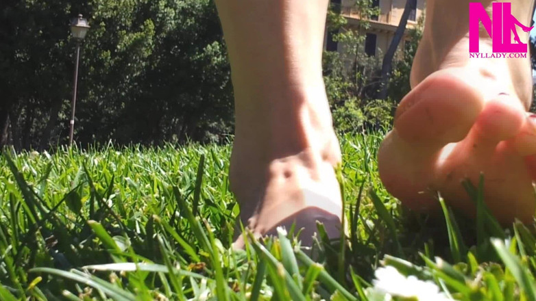 Nyllady: Nyllady Walking Barefoot on Th Grass in a Park