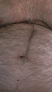 Coach Karl Shows off His Furry Belly