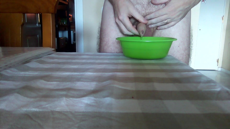 Sex hub male: John is peeing into a green bowl on the table