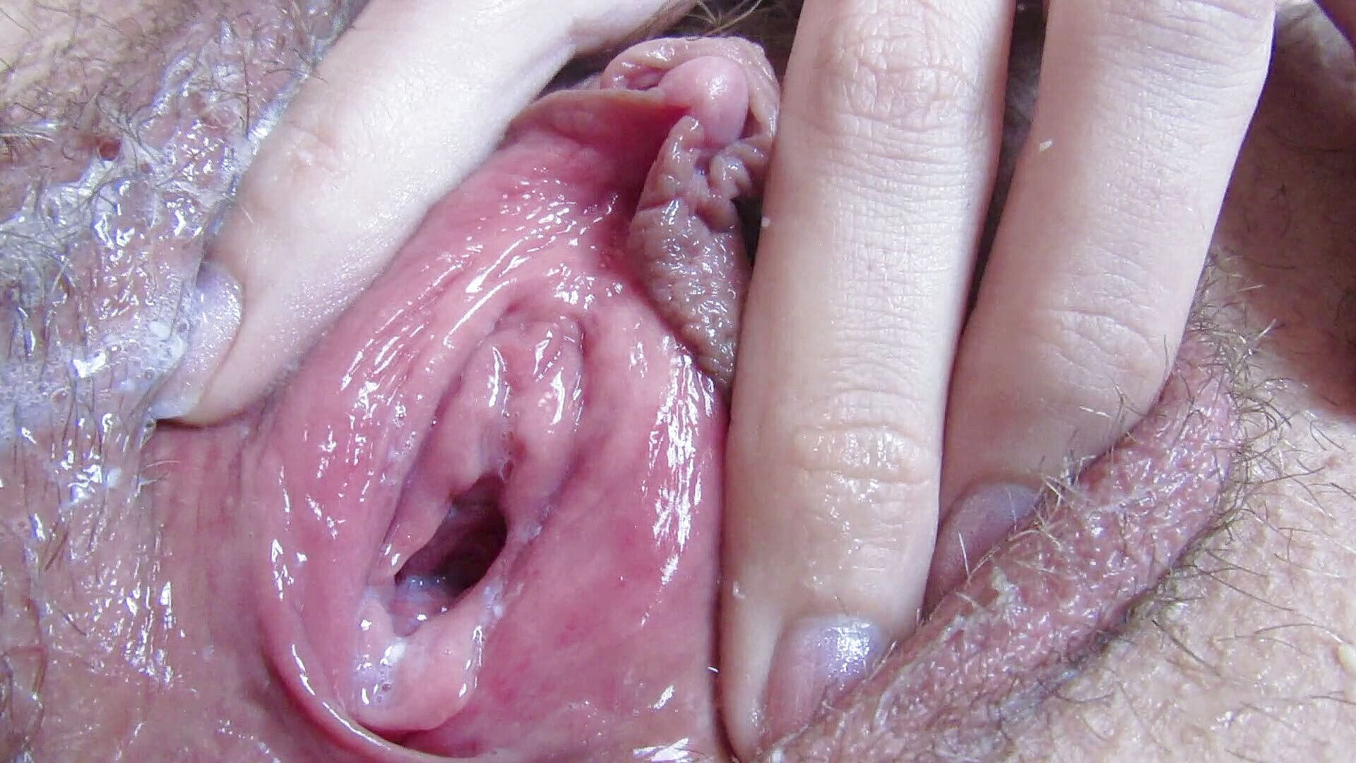 Extreme close up of a wet pussy play with penetrations after orgasm.