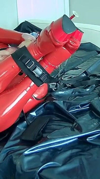 Red Latex Restraint: Hogtied Pleasure and Failed Bondage