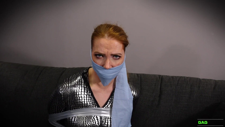 Gag Attack: Mila - Red head catsuit crook in tape bondage
