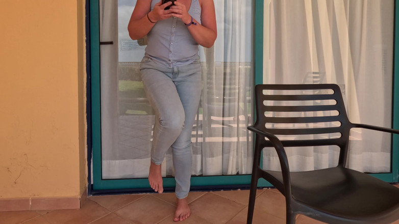Emma Voyeur: Balcony Full Bladder - Locked and Wetting Jeans