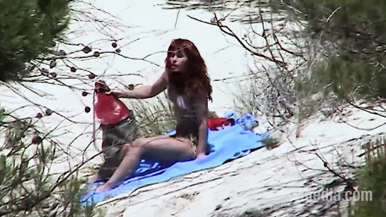 Sextermedia by Pete: Redhead Beauty Dildoing Pussy on the Sandy Beach